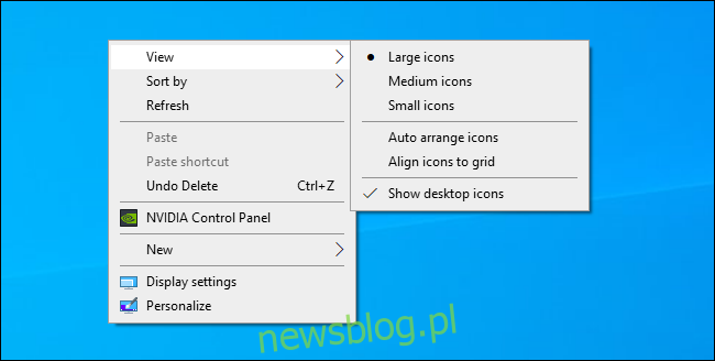 Wybór rozmiaru ikony pulpitu Windows z menu kontekstowego pulpitu.