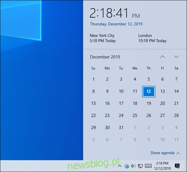 Panel zegara systemu Windows 10 pokazujący czas w trzech strefach czasowych.